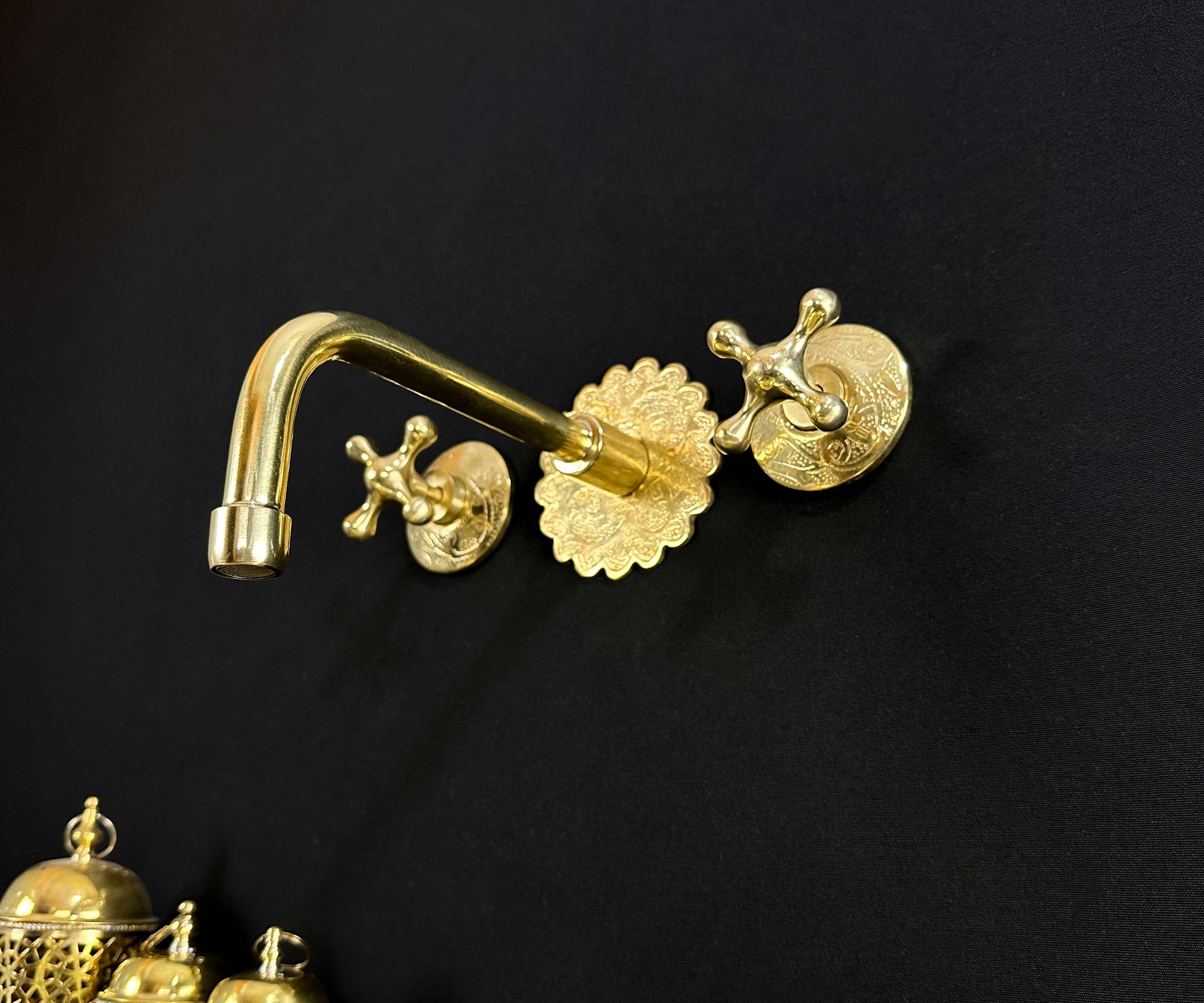 Brass Wall Faucet Installed Above Counter in Elegant Kitchen