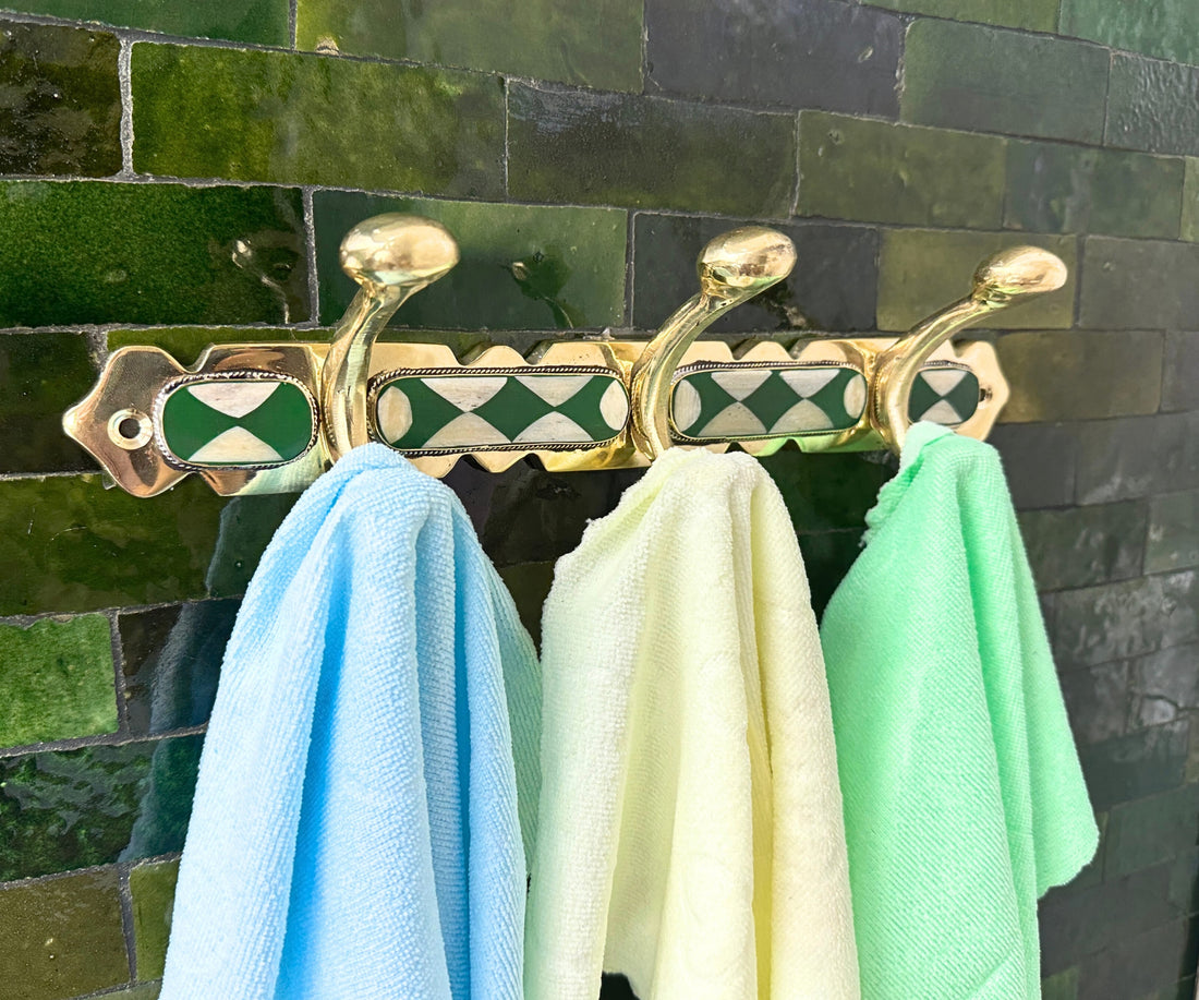 Handmade brass wall hooks with white and green resin inlay by LuxeBrass