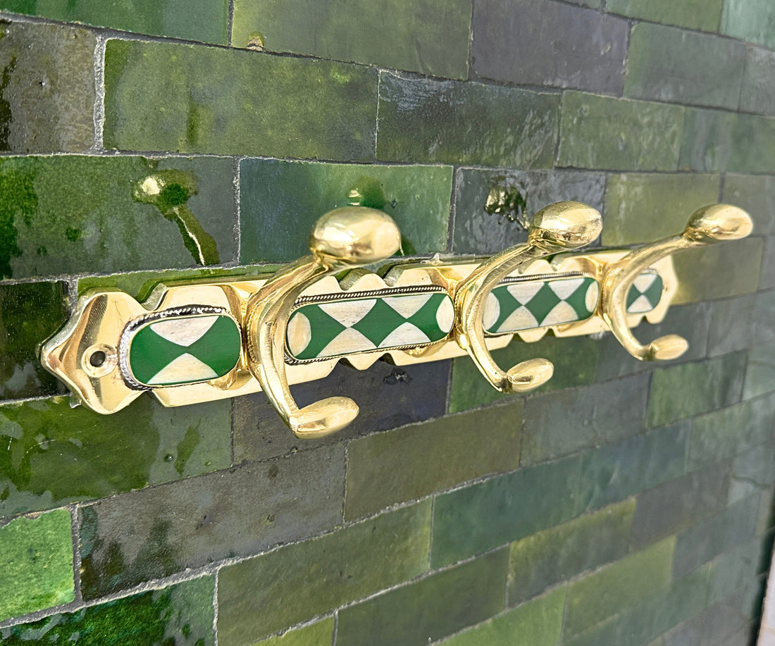 Handmade brass wall hooks with white and green resin inlay by LuxeBrass