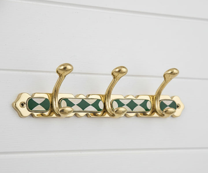 Handmade brass wall hooks with white and green resin inlay by LuxeBrass