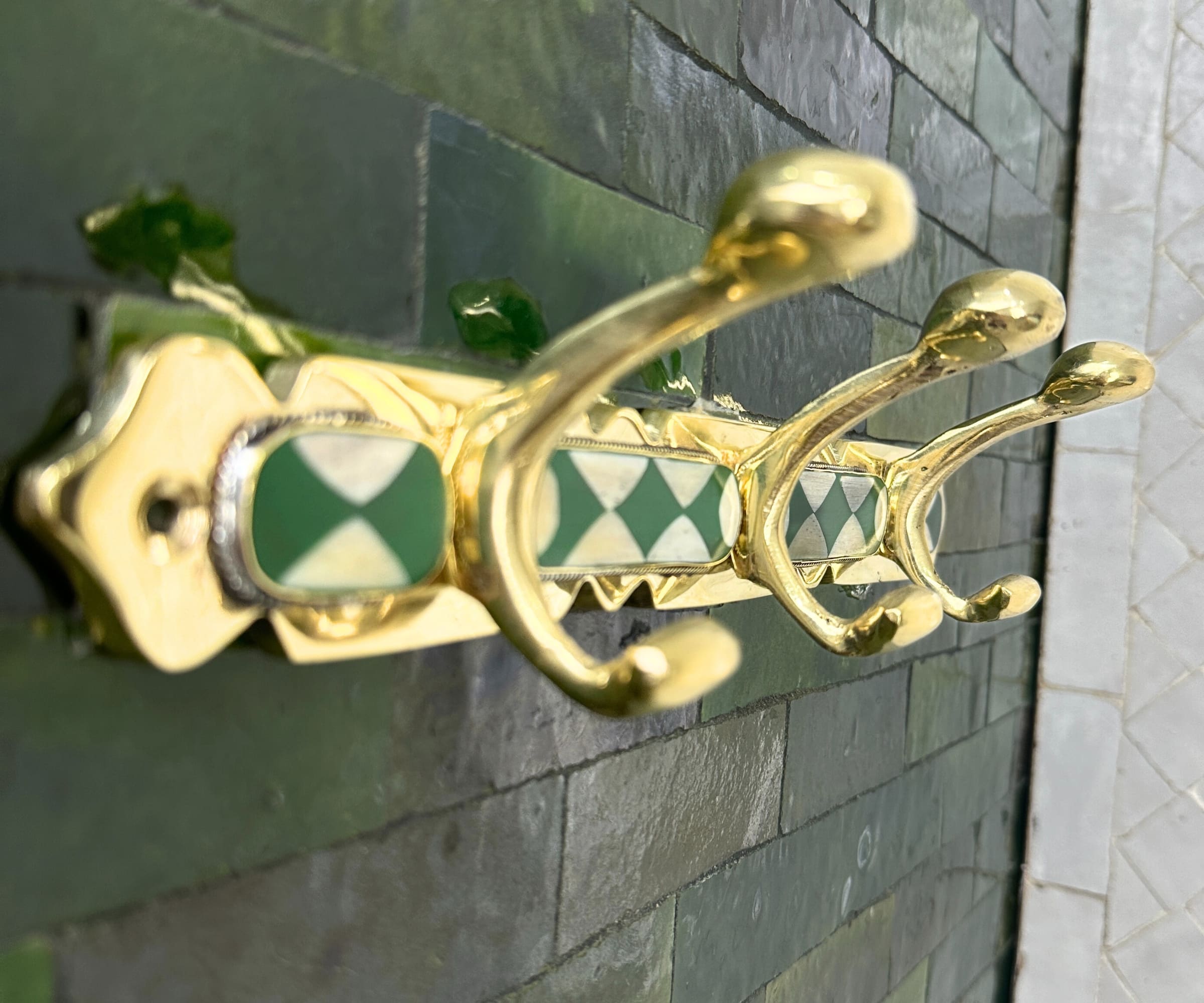Handmade brass wall hooks with white and green resin inlay by LuxeBrass