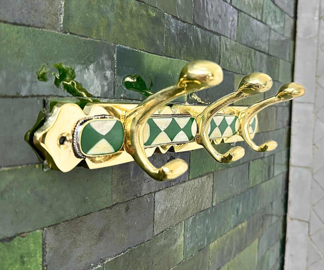 Handmade brass wall hooks with white and green resin inlay by LuxeBrass