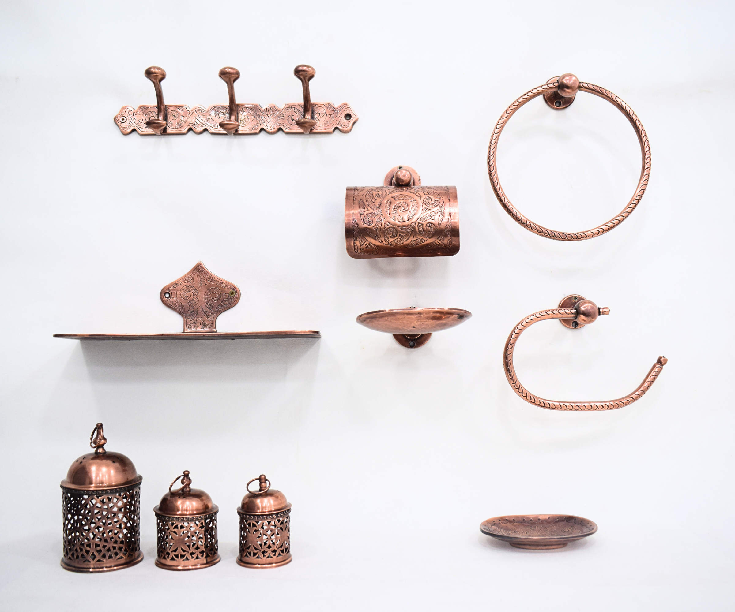 Brass bathroom accessories with copper finish