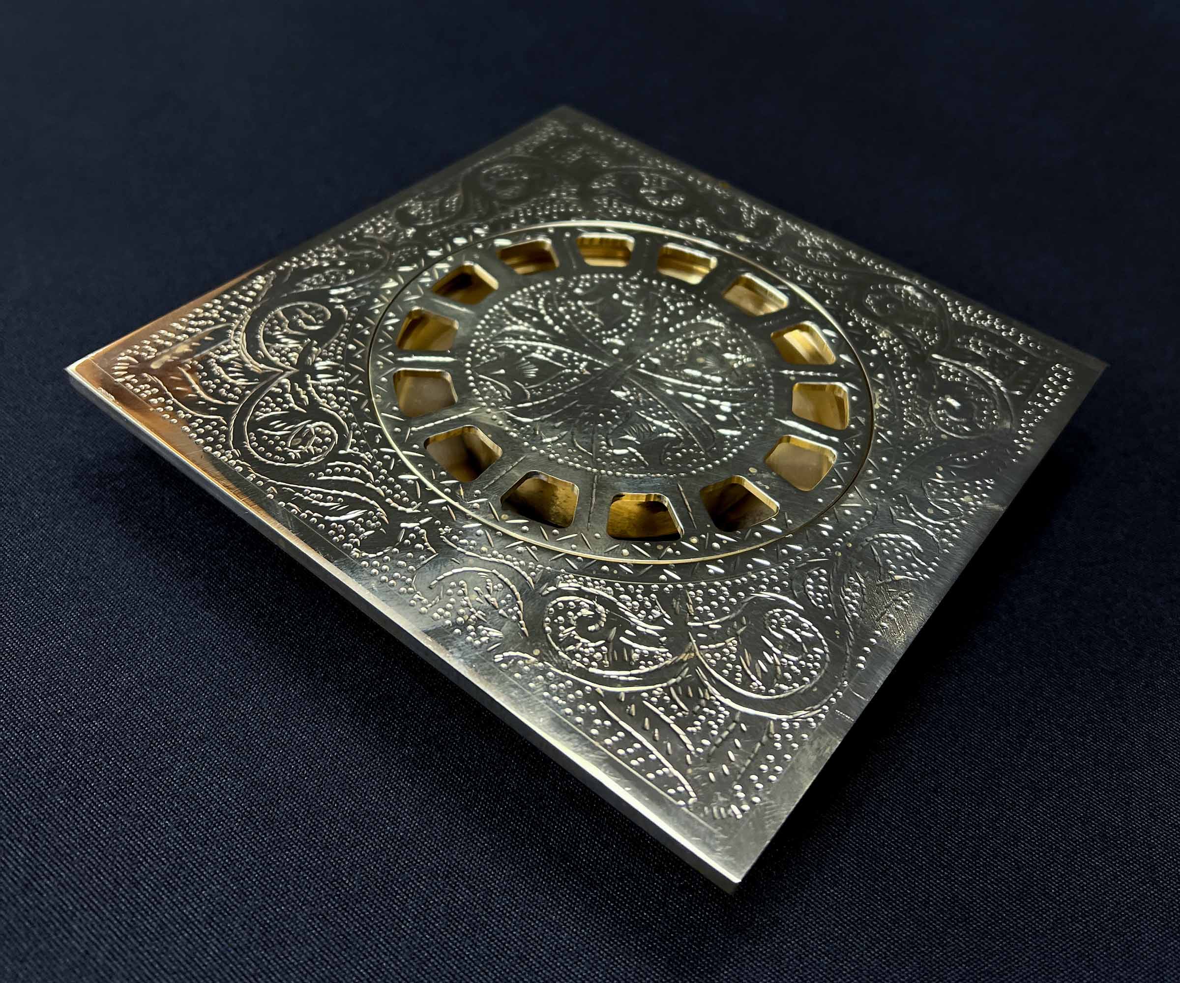 Close-up of Hand-Engraved Brass Floor Drain Pattern