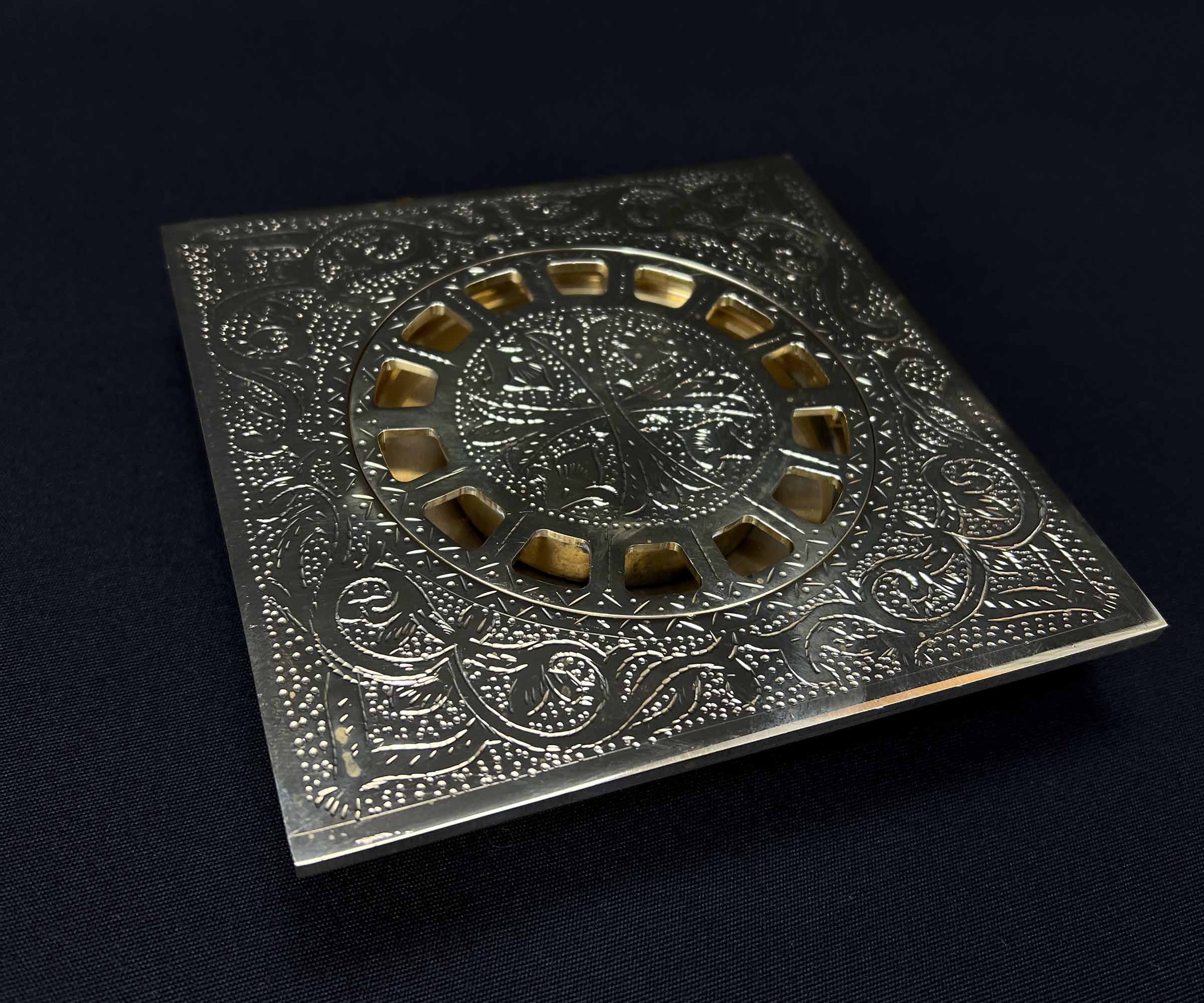 Close-up of Hand-Engraved Brass Floor Drain Pattern