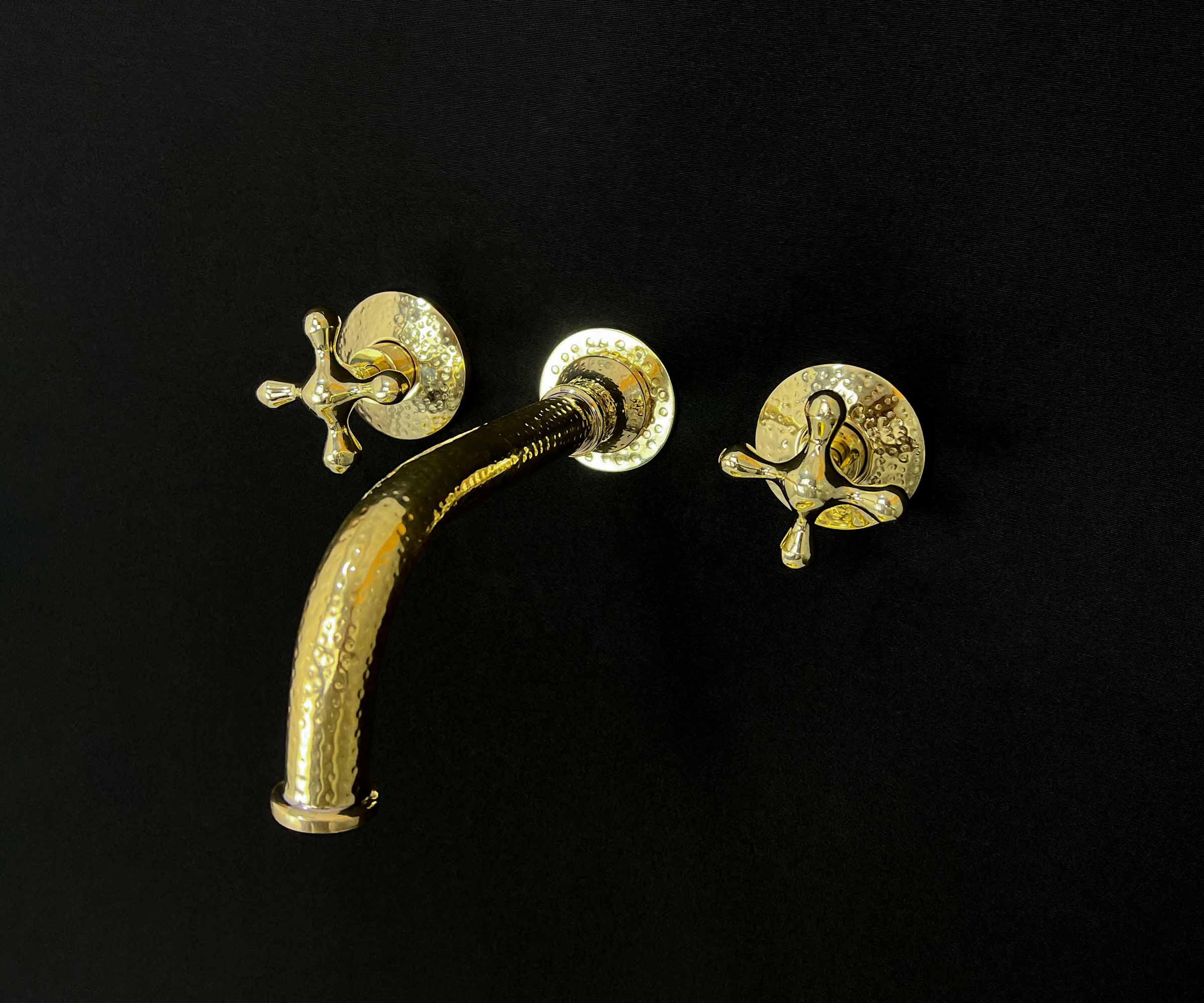 Elegant bathroom setup featuring a brass faucet