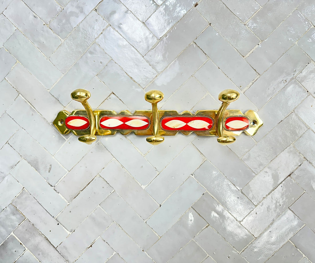 Handcrafted brass wall hooks with white and orange resin inlay by LuxeBrass