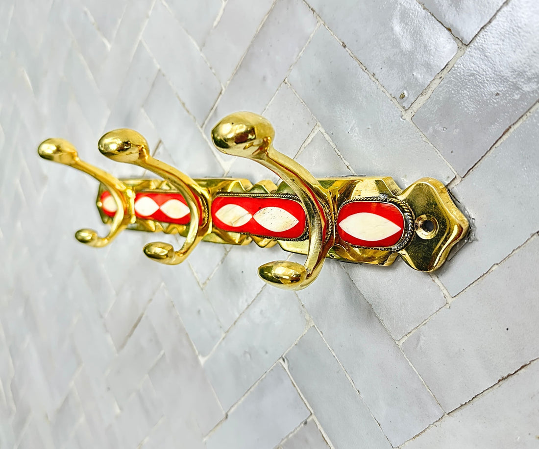 Handcrafted brass wall hooks with white and orange resin inlay by LuxeBrass