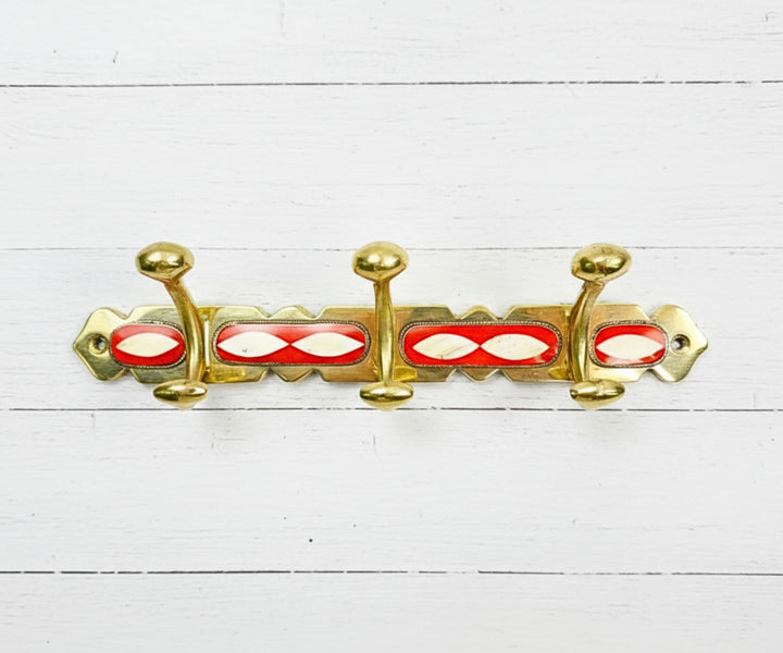 Handcrafted brass wall hooks with white and orange resin inlay by LuxeBrass