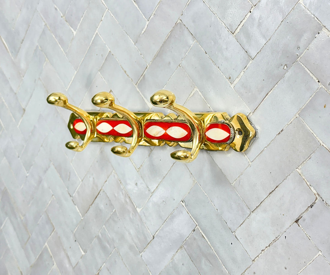 Handcrafted brass wall hooks with white and orange resin inlay by LuxeBrass