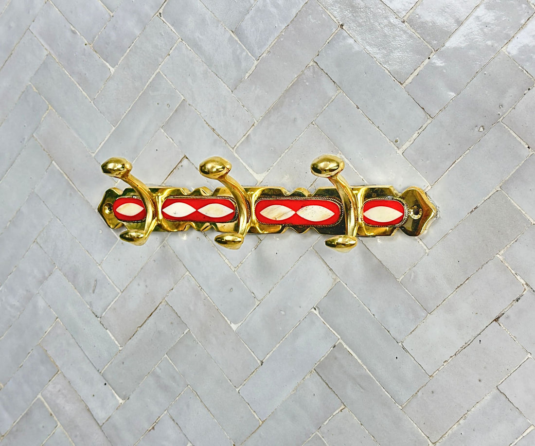 Handcrafted brass wall hooks with white and orange resin inlay by LuxeBrass