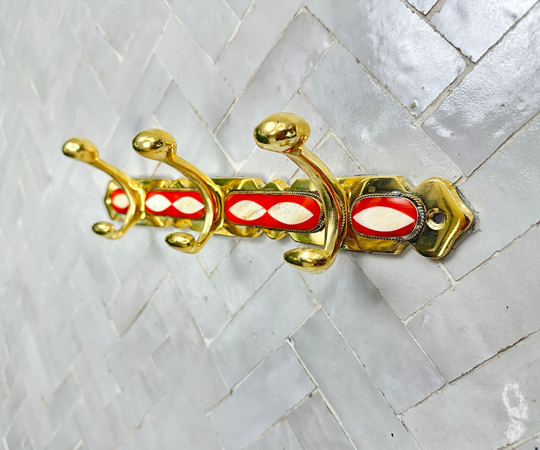 Handcrafted brass wall hooks with white and orange resin inlay by LuxeBrass