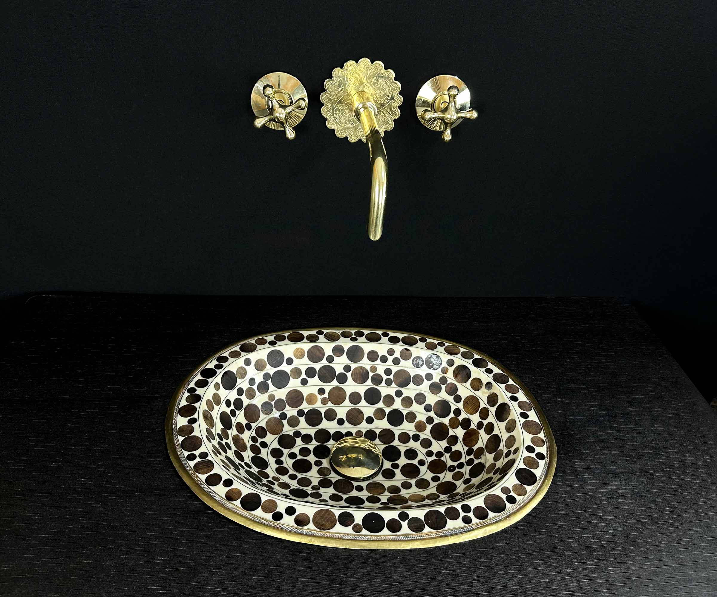 Oval Brass Sink with Circular Wood and White Resin Accents 