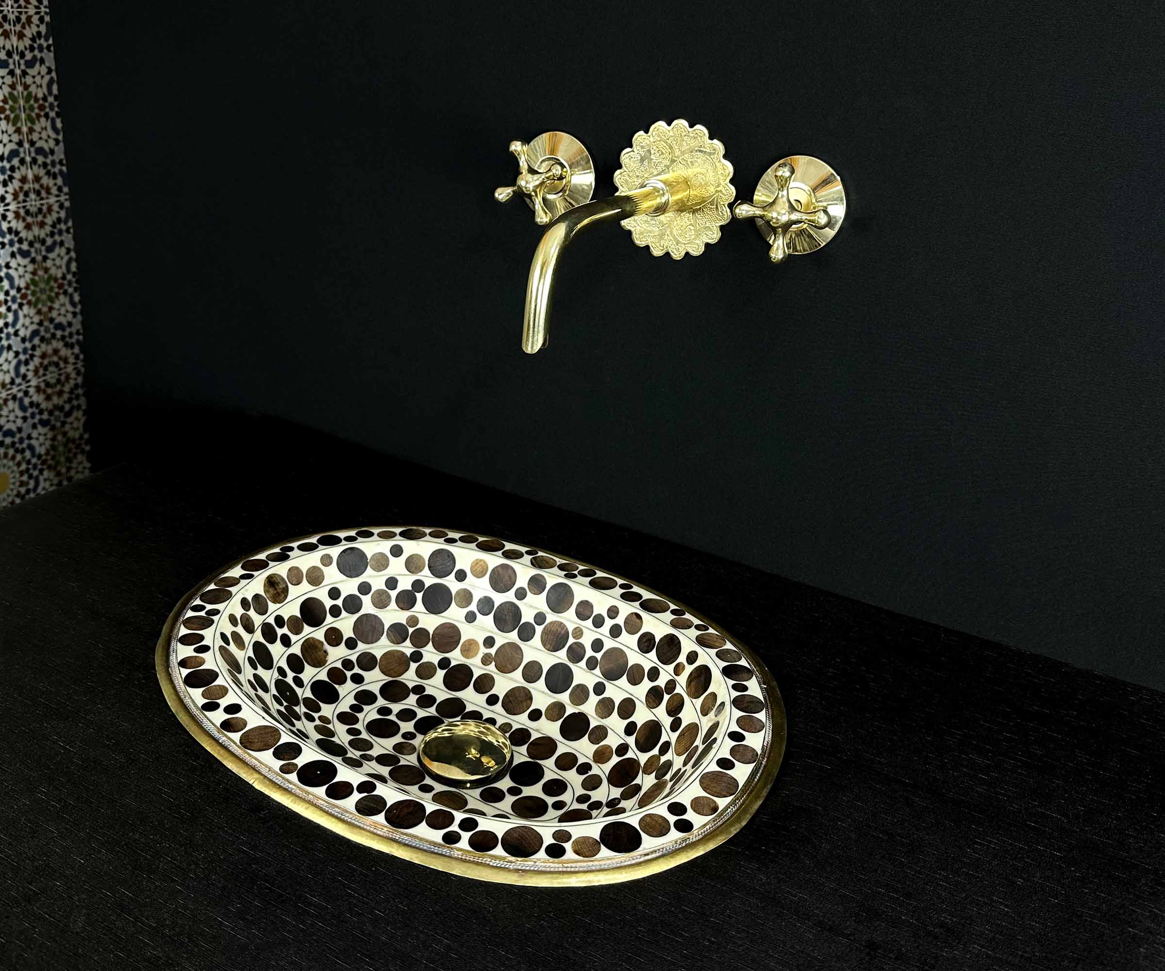 Oval Brass Sink with Circular Wood and White Resin Accents 