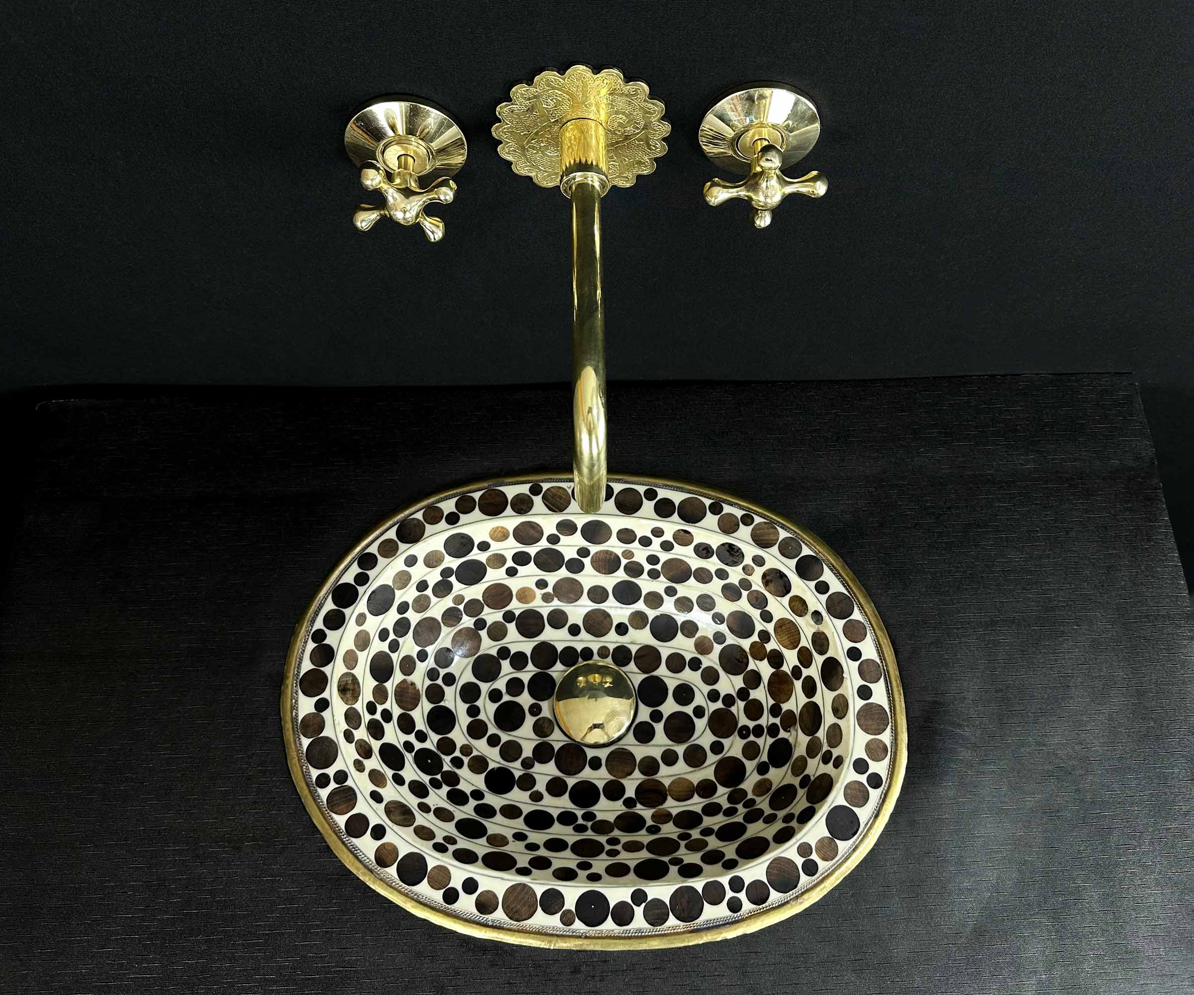 Oval Brass Sink with Circular Wood and White Resin Accents 